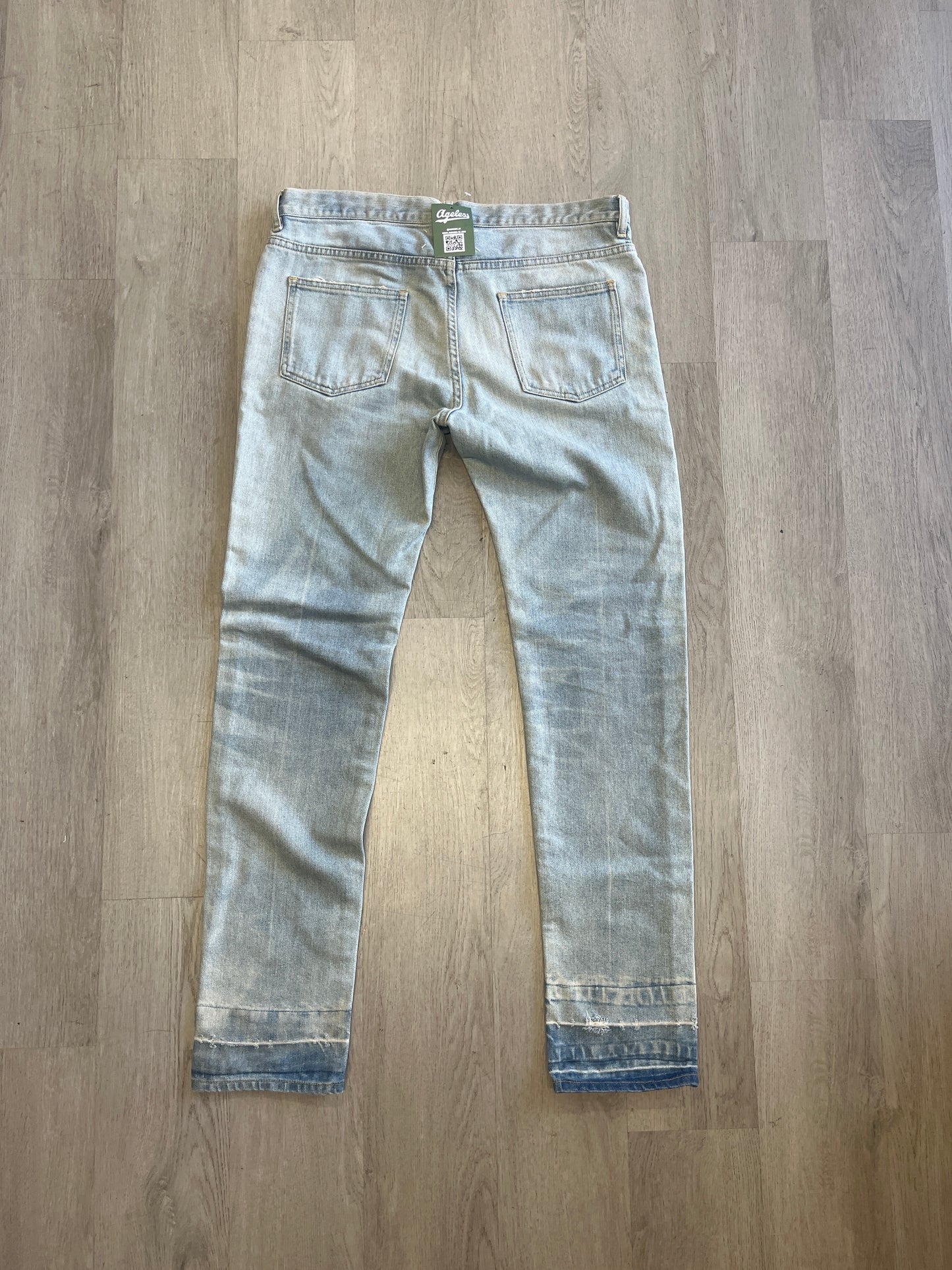 Maison Margiela Released Hem Slim Cut Light Wash Jeans