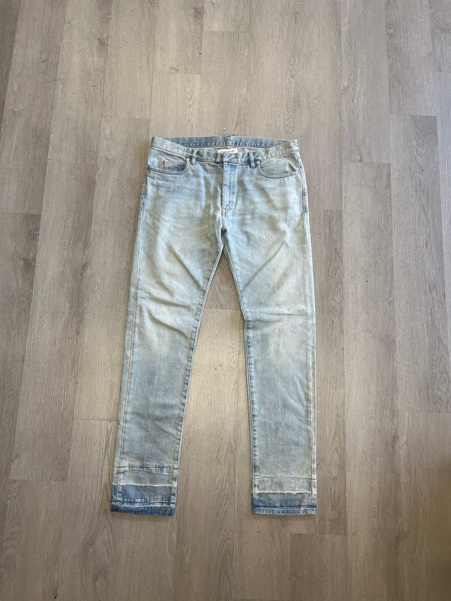Maison Margiela Released Hem Slim Cut Light Wash Jeans