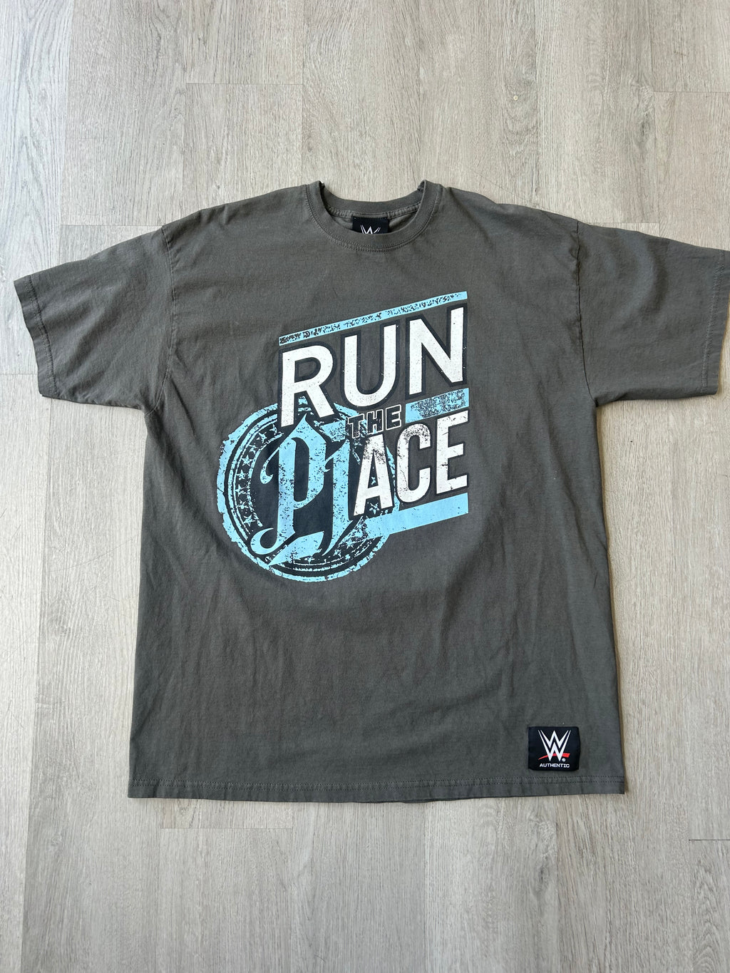 WWE  AJ Styles Run The Place Tee