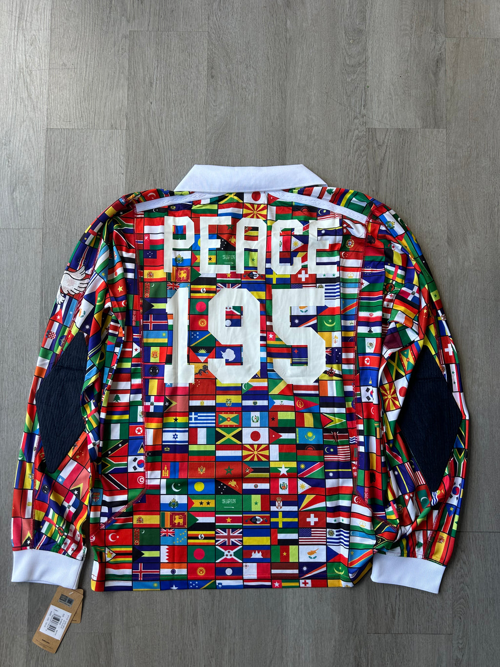 Akomplice x Umbro "World Peace" Flag Jersey